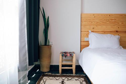 Postel nebo postele na pokoji v ubytování Manzili Surfhouse