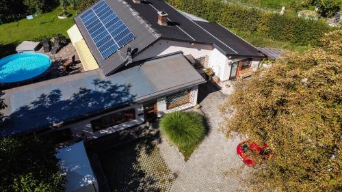 an overhead view of a house with a solar roof at Ferienwohnungen Angermaier in Flattach