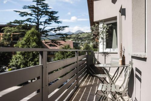 a balcony with a table and a view at apartments55 in Bressanone