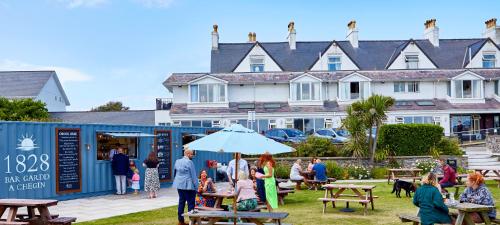 a group of people standing outside of a building at Trearddur Bay Hotel in Trearddur