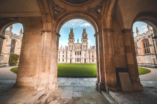 a view of a castle through an archway at Linton Lodge a BW Signature Collection Hotel in Oxford