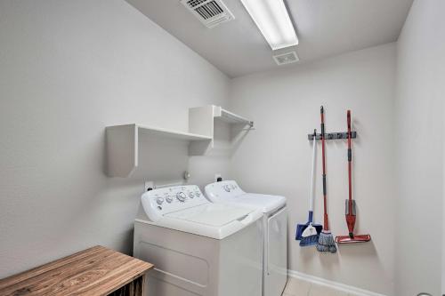 a laundry room with a white washer and sidx sidx sidx at Family Getaway with Pool Access, Near SeaWorld! in San Antonio