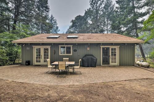 a small green house with a table and chairs at Step-Free Hawkins Bar Home Near Trinity River in Salyer