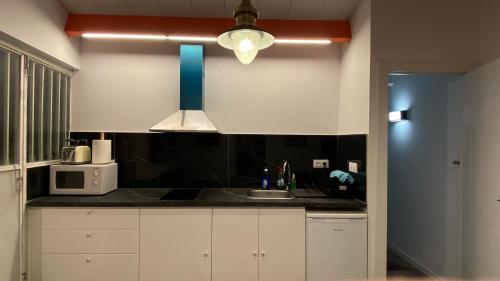 Kuchyň nebo kuchyňský kout v ubytování Apartamentos Playa