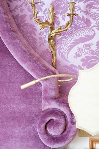 a purple toilet with a piece of paper on it at Relais & Château Louise de La Vallière in Reugny