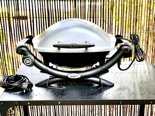 a black and white grill sitting on a table at Domaine Plan des Devens in Roussillon