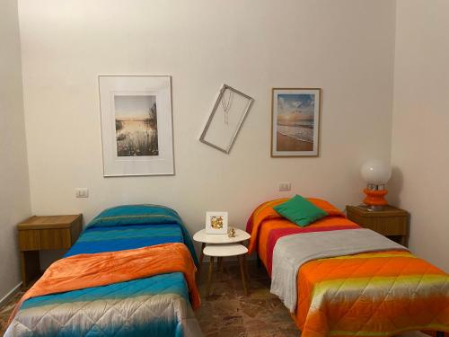 A bed or beds in a room at LA MOTOCICLETTA