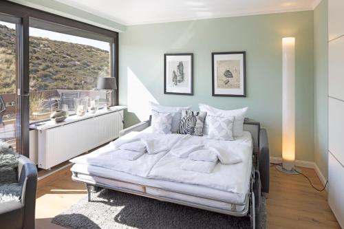 Postel nebo postele na pokoji v ubytování Dünenloft