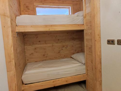 a couple of bunk beds in a tiny house at Hideaway Zugspitz Berwang in Berwang