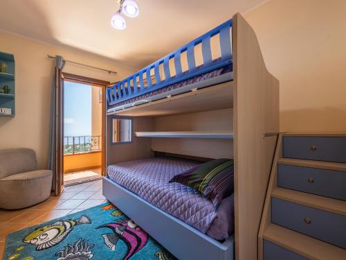 a bunk bed in a room with a staircase at casa anna in Cala Gonone