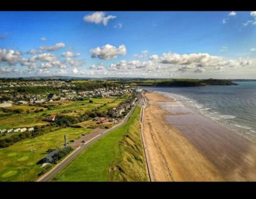 an aerial view of a beach and the ocean at Key Locker by WhatsApp , Joanna's Little Studio, Own entrance, Own Bathroom in Youghal