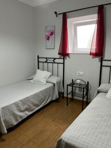 Postel nebo postele na pokoji v ubytování Pensión A Pedra
