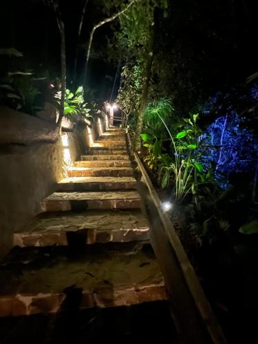 a set of stairs at night with lights at ECO HOTEL RIO DE ORO in San Rafael