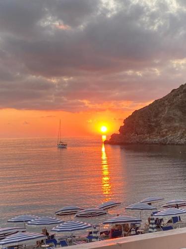a group of boats in the water at sunset at Casa Tono vacanze in Milazzo