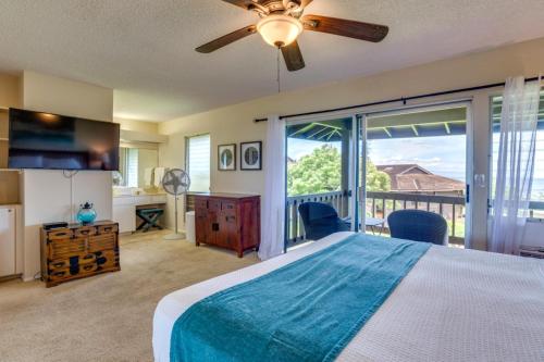 a bedroom with a bed and a large window at K B M Resorts- KPL-28 Ultimate 3Bdrm ocean view quiet neighborhood short drive or walk to Kahekili Beach Park in Kaanapali