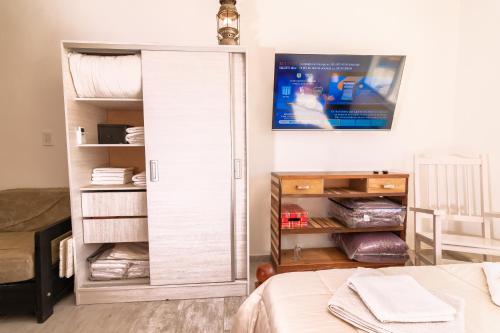 a bedroom with a bed and a closet at Asturiano 5 Miramar in Miramar