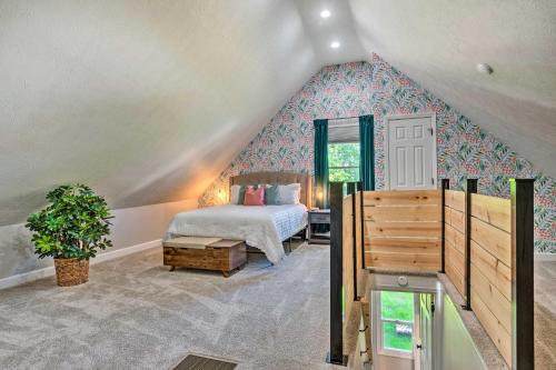 a bedroom with a bed in a attic at Quaint and Cozy Indianapolis Getaway with Yard! in Indianapolis