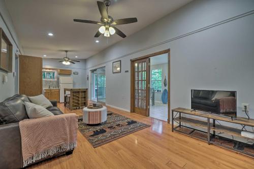 a living room with a couch and a ceiling fan at Walk to Lake Wallenpaupack Greentown Getaway in Greentown