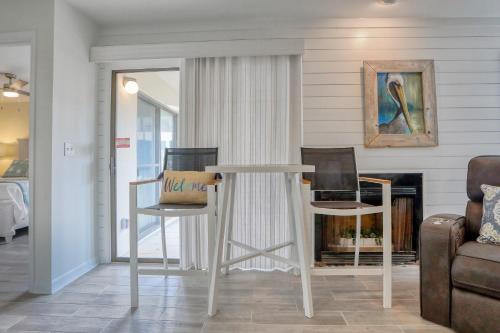 a table and two chairs in a living room at TOPS'L Tennis Village 48 in Destin