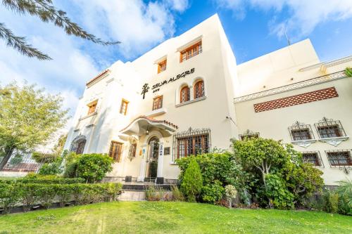 an exterior view of a white building at Hotel Boutique Selva Alegre in Arequipa