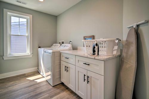 a laundry room with a washer and dryer at Gorgeous Newly Built Home Golf Course View! in Brigantine
