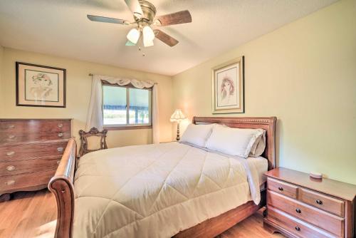 a bedroom with a bed and a ceiling fan at Hugo Home, Direct Lake Access and Private Dock! in Hugo