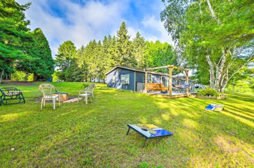 Taman di luar Riverfront Home with Dock about 6 Mi to Cheboygan!