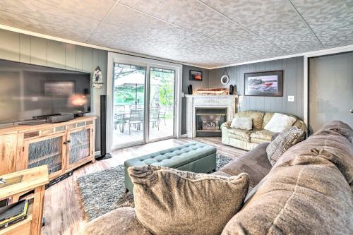 Televisyen dan/atau pusat hiburan di Riverfront Home with Dock about 6 Mi to Cheboygan!
