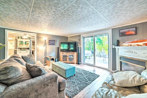 Televisyen dan/atau pusat hiburan di Riverfront Home with Dock about 6 Mi to Cheboygan!