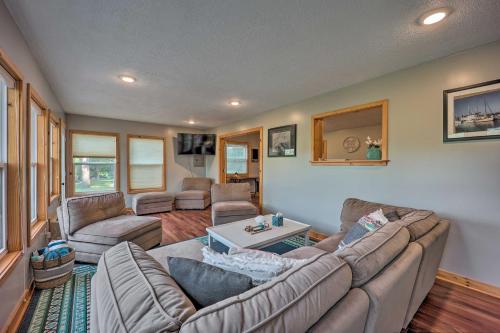 a living room with a couch and a table at Private Eureka Springs Retreat with Hot Tub! in Eureka Springs