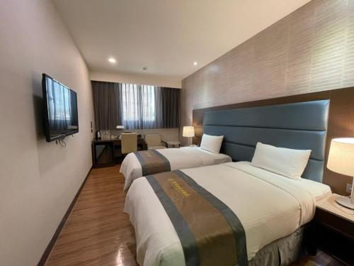 Postel nebo postele na pokoji v ubytování Royal Gold Hotel