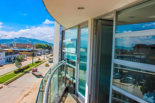 a balcony of a building with a view of a city at Holly Hotel in Duitama