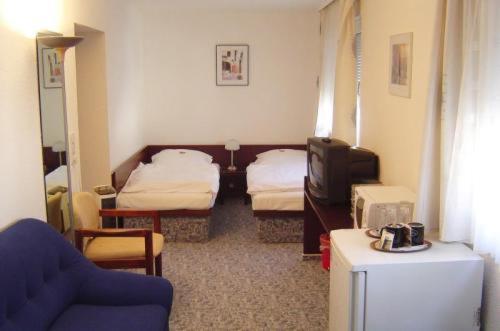 Ein Bett oder Betten in einem Zimmer der Unterkunft Hotel & Restaurant Raisch