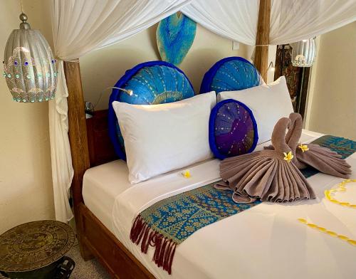Ένα ή περισσότερα κρεβάτια σε δωμάτιο στο Villa Kalisat Resort