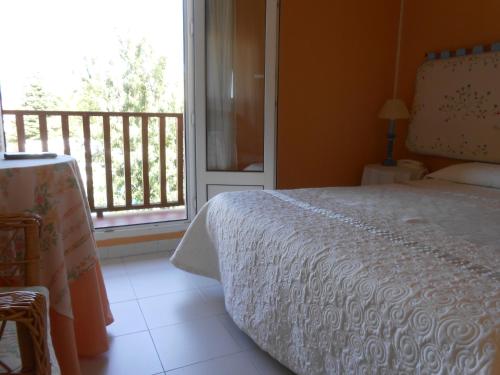 Postel nebo postele na pokoji v ubytování Hostal Burgos