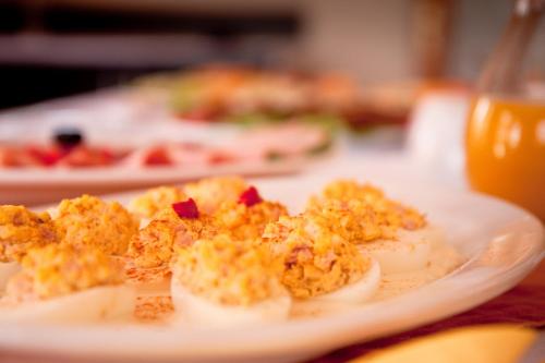 a plate of food with deviled eggs on a table at Pension Panorama in Odorheiu Secuiesc