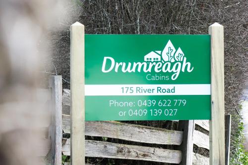 a sign for the durham durham cavaliers on a fence at Drumreagh Cabins in Deloraine