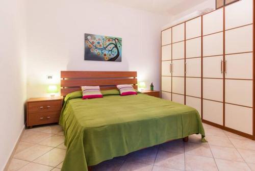 Ένα ή περισσότερα κρεβάτια σε δωμάτιο στο via dessi Orosei