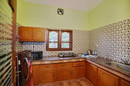 Kuchyň nebo kuchyňský kout v ubytování Zenha Resorts