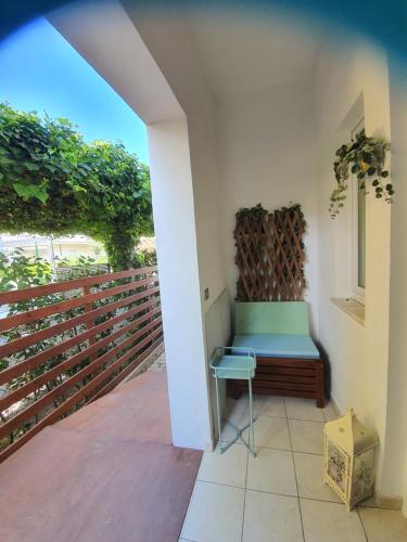 a bench on a balcony with a fence at B&B Airone Cervia - Camere e Appartamenti in Cervia