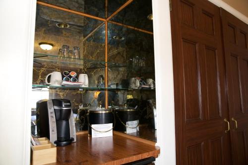 a kitchen with a counter with a coffee maker at Spokane Club Hotel in Spokane