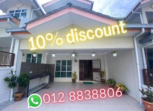 a building with a sign that reads percent discount at HILLVIEW HOMESTAY in Tanah Rata