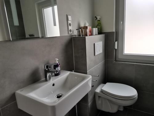 Ένα μπάνιο στο Ferienwohnung Ewa