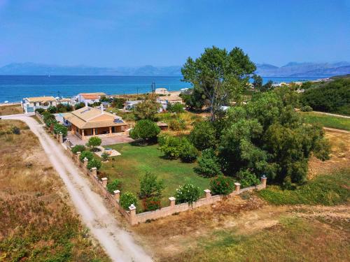 an aerial view of a house with a garden at Drosia Beach House Almyros Corfu in Almiros Beach