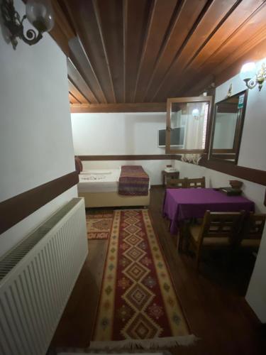 a living room with a purple table and a purple table at Avcıoğlu Konak Otel in Safranbolu