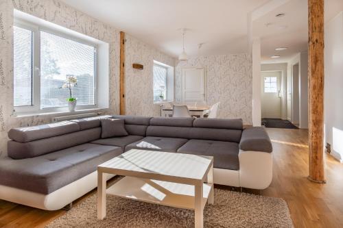 a living room with a couch and a table at Relax Interior Stylish House in Rakvere in Rakvere