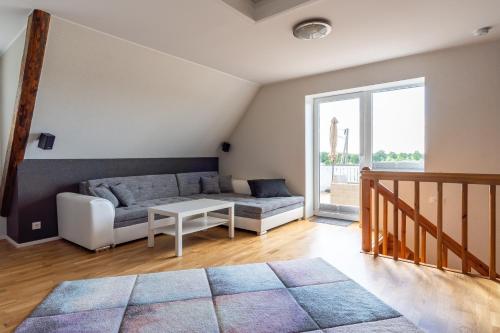 a living room with a couch and a table at Relax Interior Stylish House in Rakvere in Rakvere