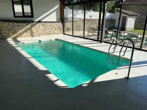 a swimming pool in the middle of a house at Casa Bella in Dunavtsi