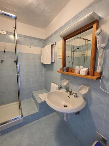 Koupelna v ubytování Hotel Olimpia