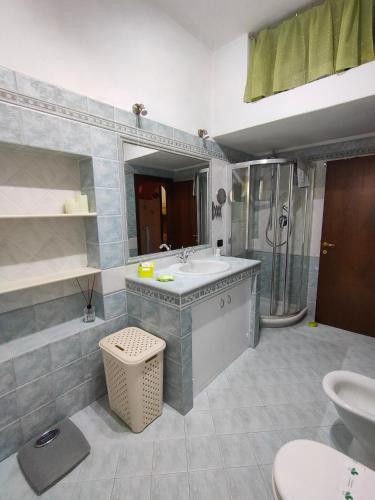 a bathroom with a sink and a shower at Da Barbara & Simone in Collemezzano
